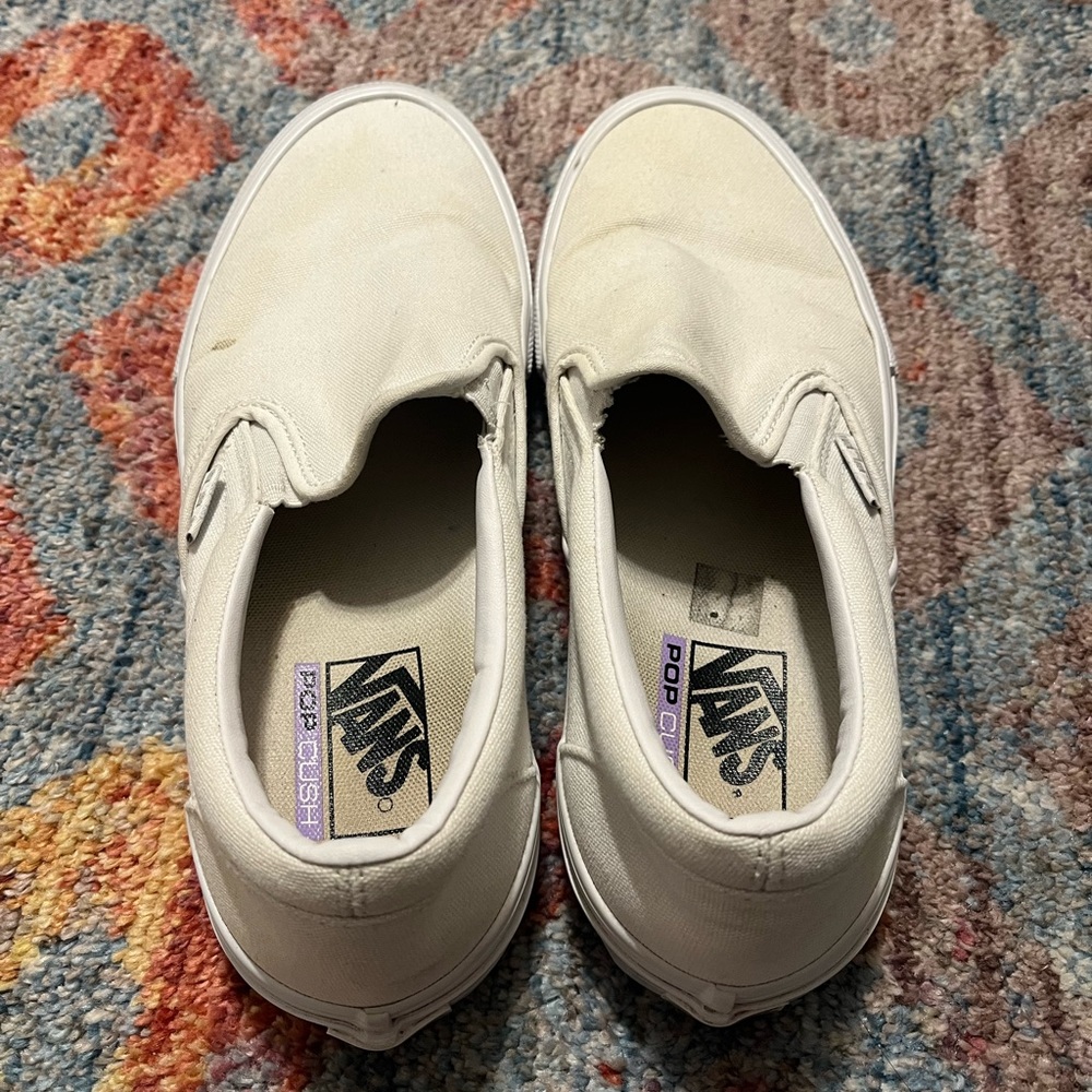 All white slip on Vans
